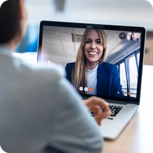 A woman taking part in an online meeting